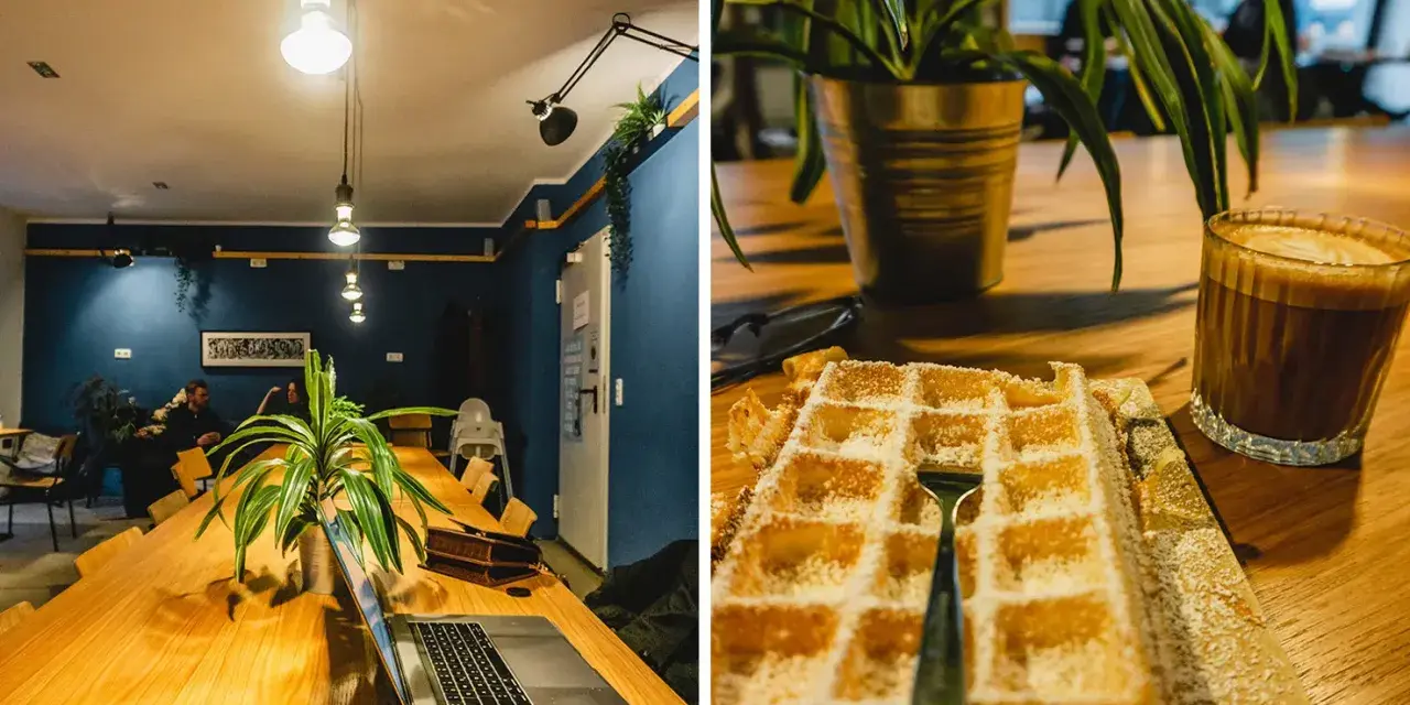 Gemütliches Cafe mit langen Holztisch, Laptop und Waffel mit Kaffee. Perfekt zum cafe lernen und entspannen.